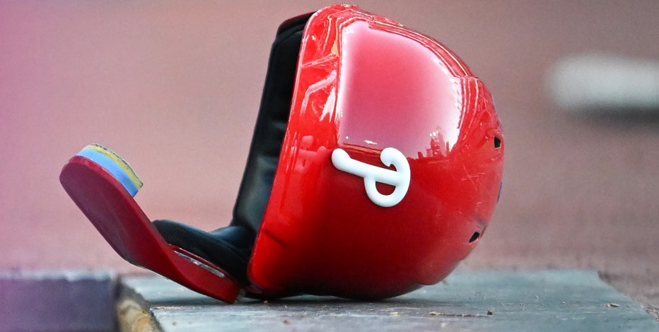 Young Phillies fan given helmet after Harper flips on ump - ESPN