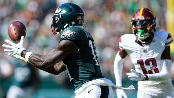Hurts throws for 319 yards, Elliott's 54-yarder lifts 4-0 Eagles past Commanders 34-31 in OT