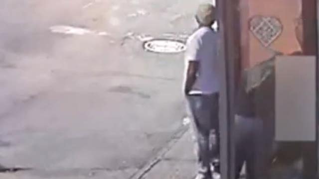 Caught on camera: Woman robbed by armed duo while waiting for bus in North Philadelphia