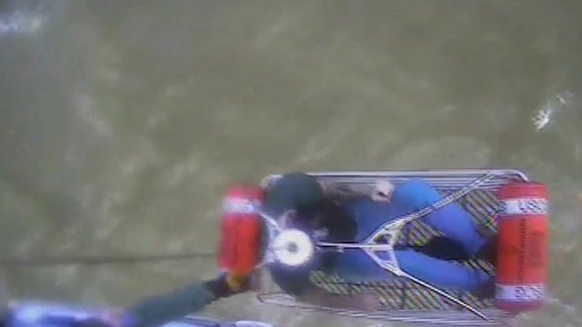 Watch: 3 rescued by U.S. Coast Guard helicopter crew after boat capsizes in Great Bay, NJ