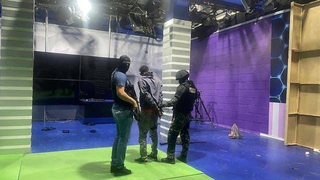 Armed men storm Ecuadorian TV studio, brandishing explosives and guns during live broadcast
