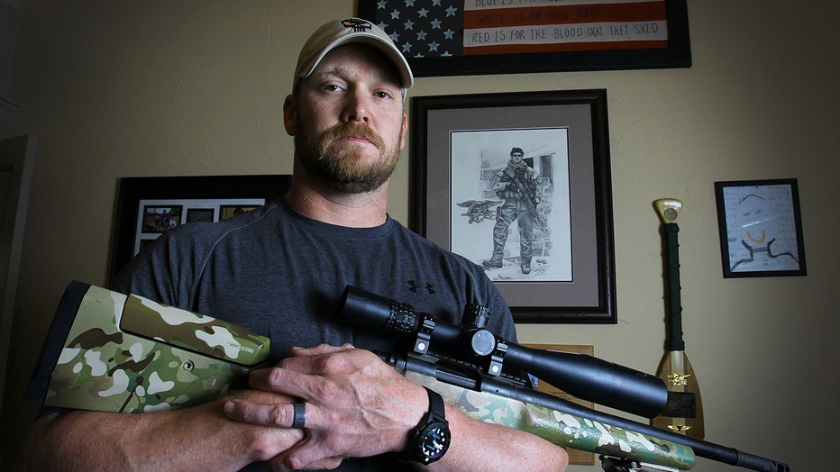Chris Kyle holds a .308 sniper rifle in this April 6, 2012, file photo. (Credit: Paul Moseley/Fort Worth Star-Telegram/Tribune News Service via Getty Images)