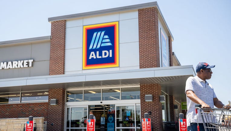 FILE - A customer walks out of an Aldi supermarket on Aug. 17, 2023, in Pflugerville, Texas. (Photo by Brandon Bell/Getty Images)
