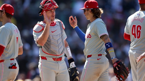 Stott and Realmuto homer, Walker makes a slick play as the Phillies win 8-6 to sweep the Padres