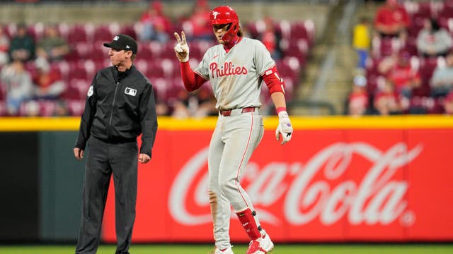 Santiago Espinal has 3 RBIs, Fernando Cruz pitches out of another jam and Reds beat Phillies 7-4