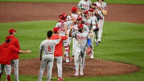 Phillies wait out an extra-inning rain delay, then outlast the Orioles 5-3 in 11