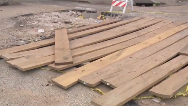 Video: Giant crater causing frustration for residents as cars become trapped on Philly street