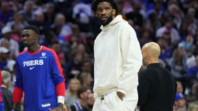 Embiid drawing criticism for sitting out 76ers' opener as part of health plan to reach the playoffs