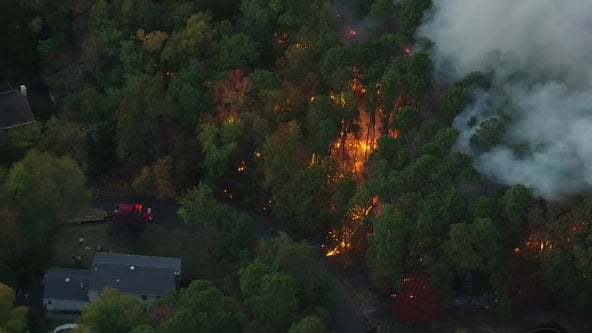 Huge brush fire contained after burning dangerously close to Medford homes