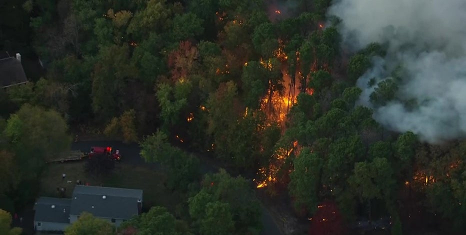 Huge brush fire contained after burning dangerously close to Medford homes