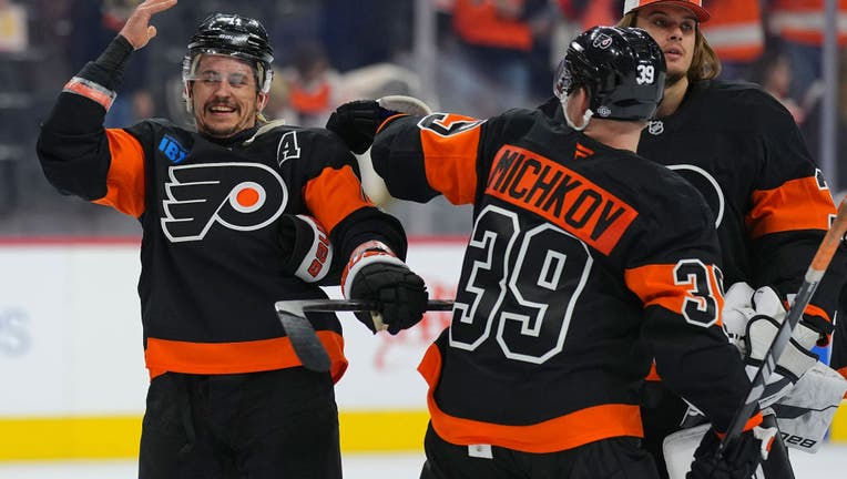 PHILADELPHIA, PENNSYLVANIA - NOVEMBER 16: Travis Konecny #11 and Matvei Michkov #39 of the Philadelphia Flyers react after the game against the Buffalo Sabres at the Wells Fargo Center on November 16, 2024 in Philadelphia, Pennsylvania. The Flyers defeated the Sabres 5-2. (Photo by Mitchell Leff/Getty Images)