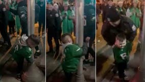 Young Eagles fan gets fake arrested for trying to climb pole in viral video