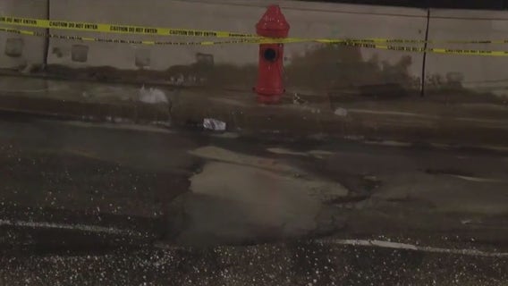 Burst pipe creates dangerous conditions as water freezes on street in University City