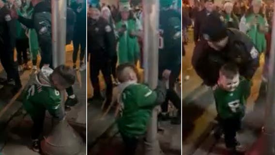 Young Eagles fan gets fake arrested for trying to climb pole in viral video