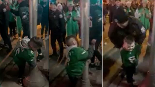 Young Eagles fan gets fake arrested for trying to climb pole in viral video
