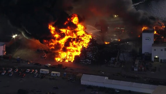 Massive junkyard fire under control and extinguished, officials say