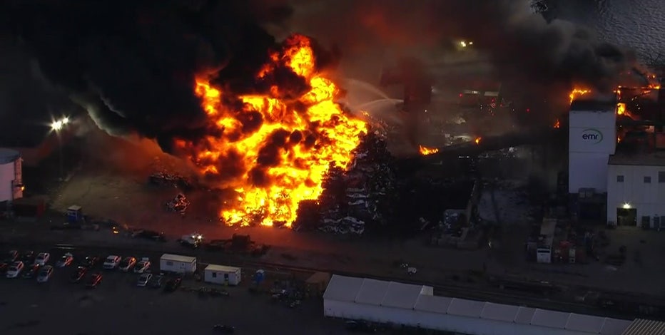 Massive junkyard fire under control and extinguished, officials say