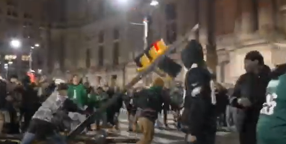 More than 20 suspects sought for tearing down poles during Super Bowl celebration