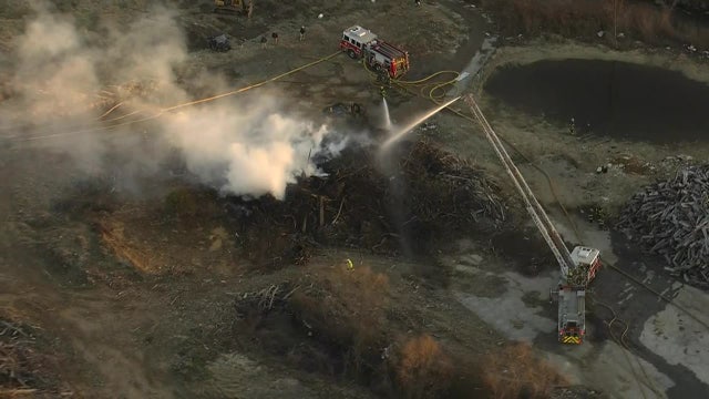 Brush fire in West Philadelphia prompts large fire, police response