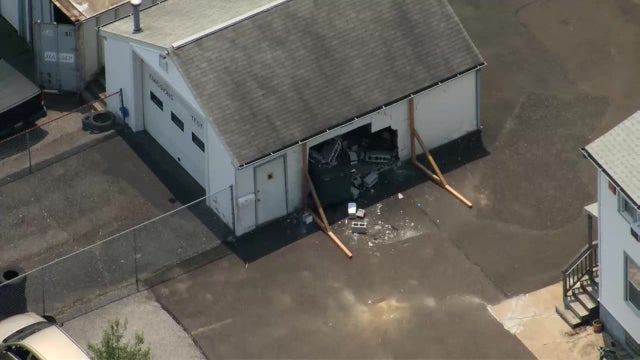 Chain-reaction crash sends car into building, injures driver in Bucks County