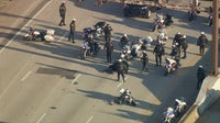2 officers crash motorcycles on I-95 while participating in motorcade to charity event