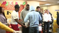 Eagles players hand out 250 Thanksgiving turkeys, sides at Camden FamGiving drive