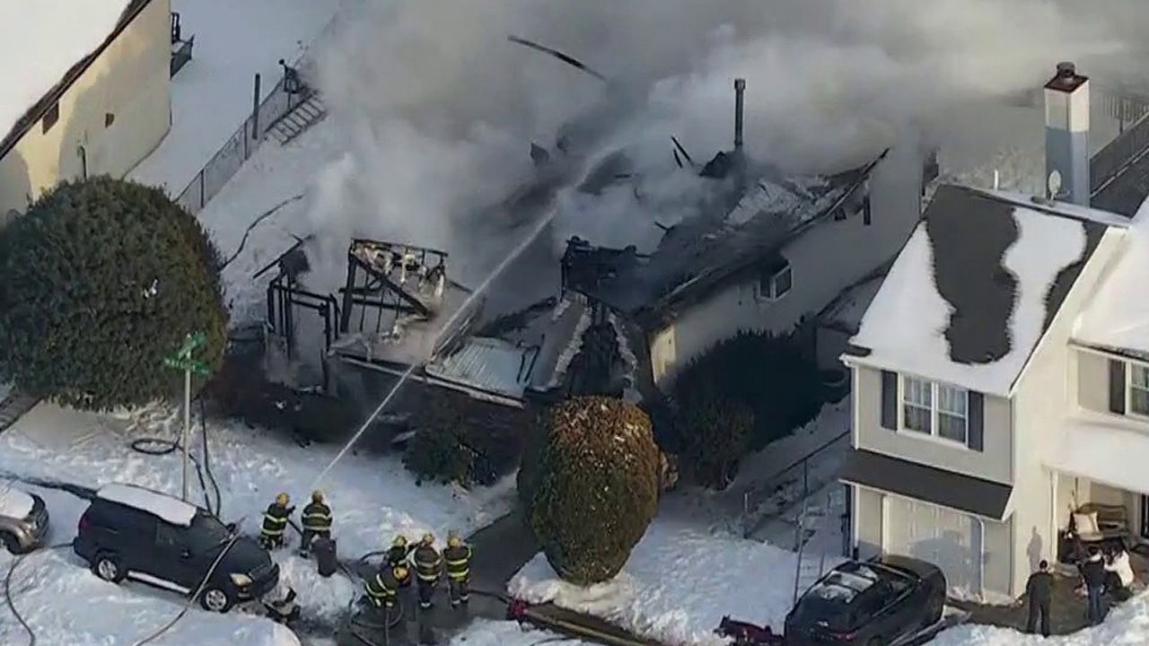 Somerton house fire: Neighbor rescues 85-year-old woman, fire crews search for man