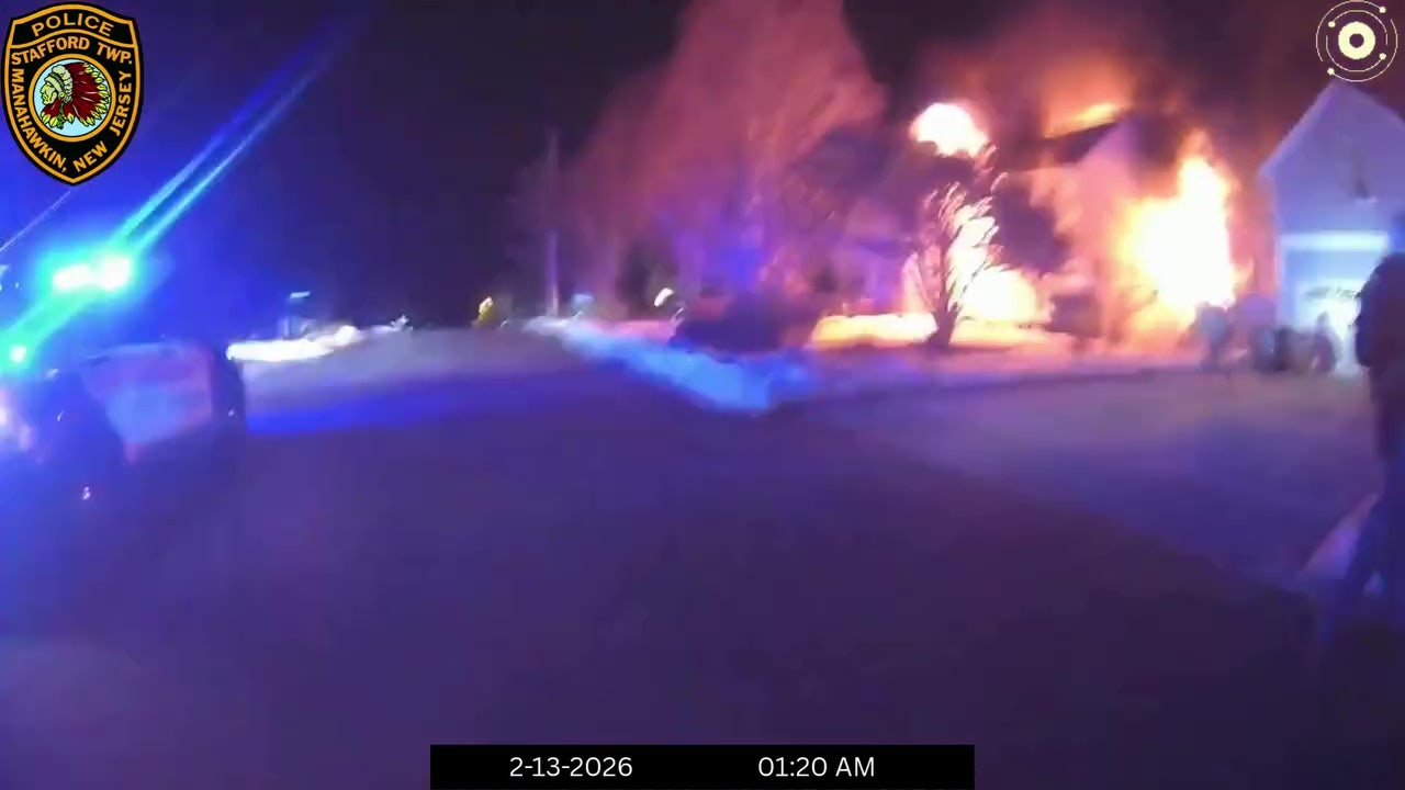WATCH: NJ police officers catch man jumping off balcony to escape burning home