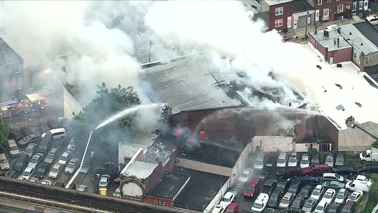 Firefighters battle 2-alarm fire at garage in Kensington