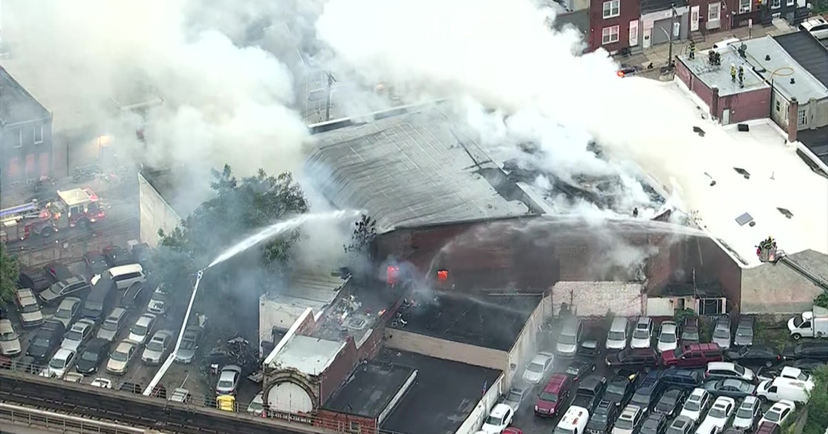 Firefighters battle 2-alarm fire at garage in Kensington