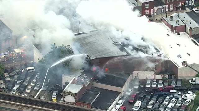 Firefighters battle 2-alarm fire at garage in Kensington