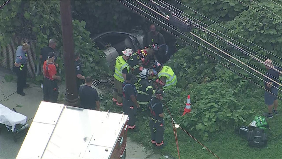 Driver, passenger survive after car crashes, plunges into embankment along Chester Pike