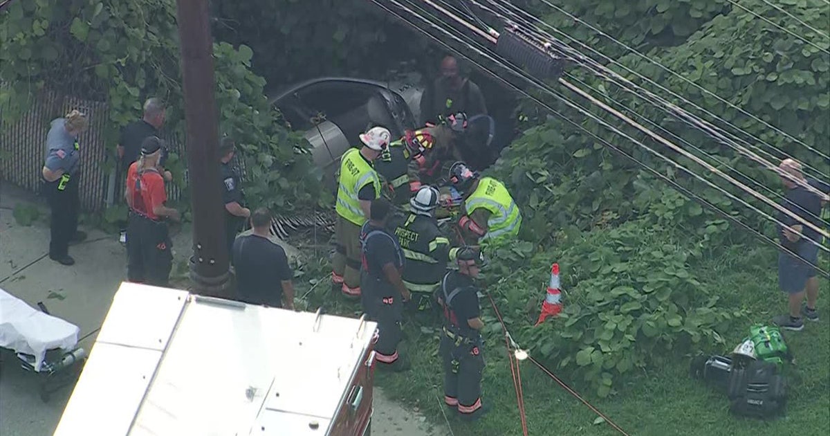 Driver, passenger survive after car crashes, plunges into embankment along Chester Pike