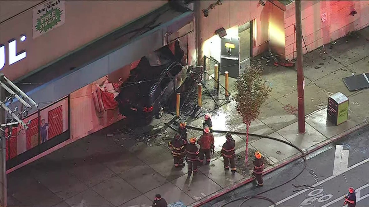 Driver dead after car goes airborne, slams into side of building in Kensington