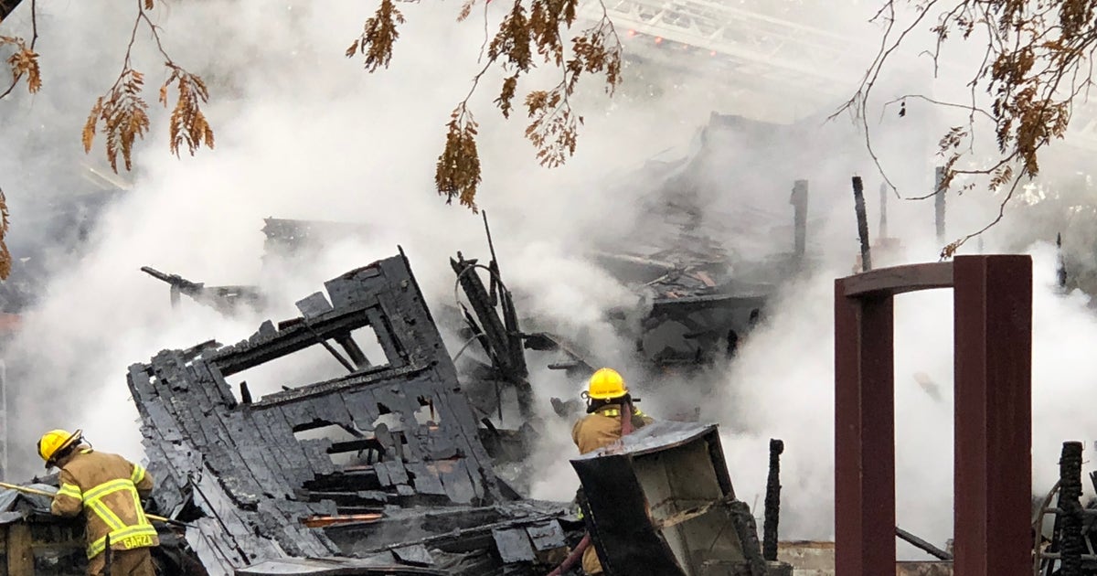 Fire destroys 2 homes, woman jumps to safety | FOX 2 Detroit
