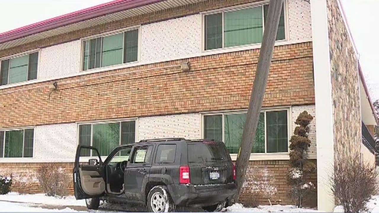 Driver shot in head before crashing outside Detroit motel