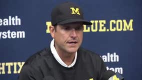 Harbaugh tells players' parents he's not leaving