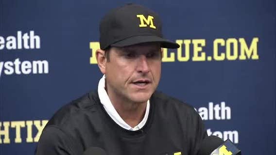 Harbaugh tells players' parents he's not leaving