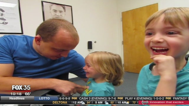 Donated hearing aids allow dad to hear kids for the first time