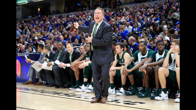 No. 1 Kansas holds off No. 10 Michigan State 92-87 in opener