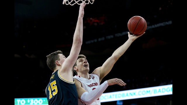 Happ, Wisconsin hand No. 2 Michigan its first loss, 64-54