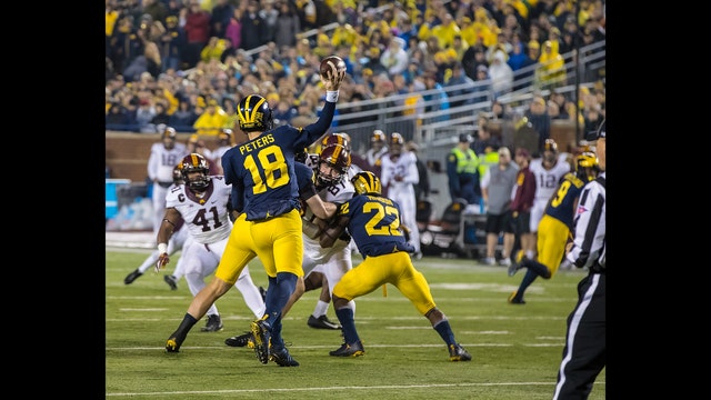 No. 21 Michigan-Maryland matches teams with issues at QB