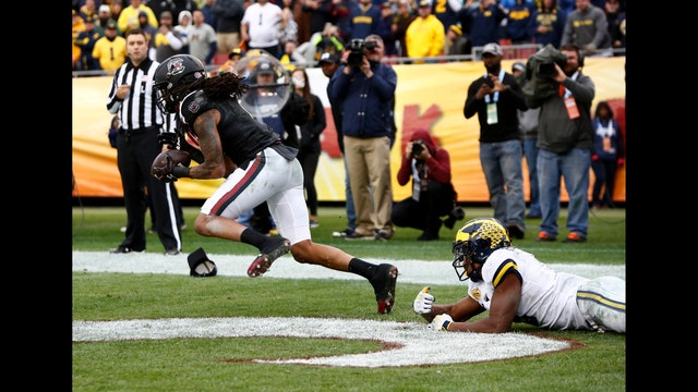 South Carolina rolls past Michigan 26-19 in Outback