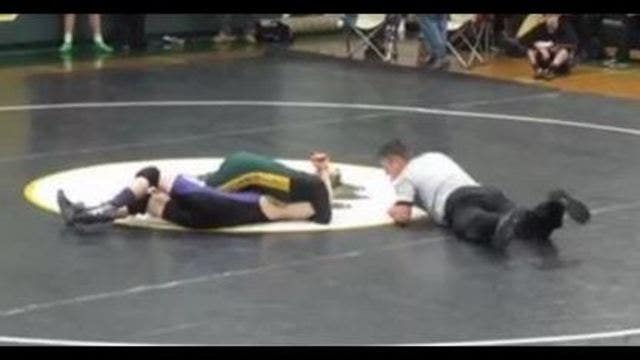 Undefeated wrestling team captain lets student with Down syndrome pin him