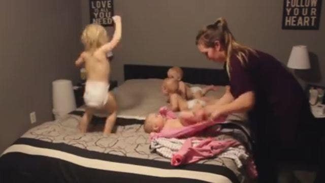 Video goes viral of 'Super Mom' dressing four young kids