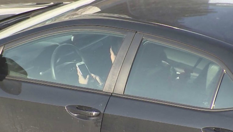 Distracted driver using a cell phone while driving-404023