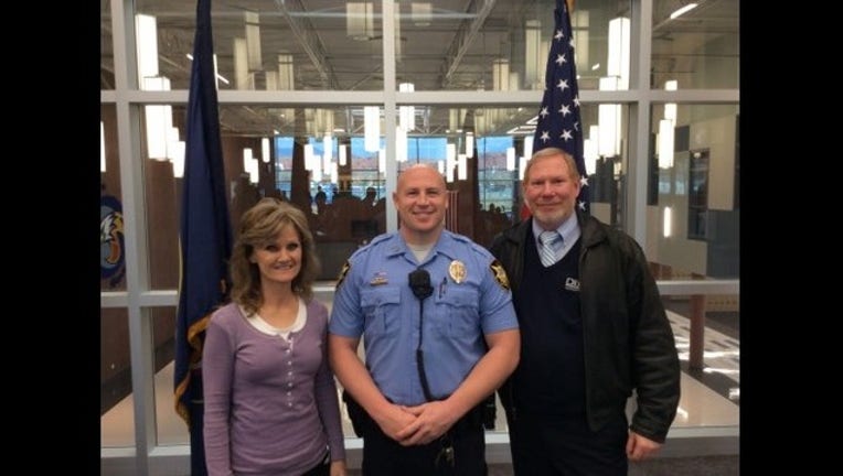 cop saves two lives in one day_1449867173220.JPG