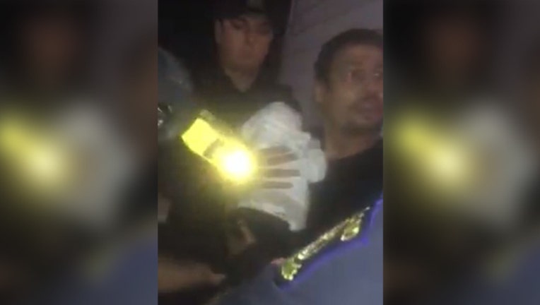 wjbk_tased_with_baby_in_arms_08-20-18_1534796265513.JPG_5950057_ver1.0_640_360_1534969082954.jpg.jpg