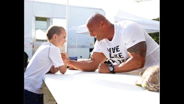 the rock helps boy fight cancer_1462284173447.JPG