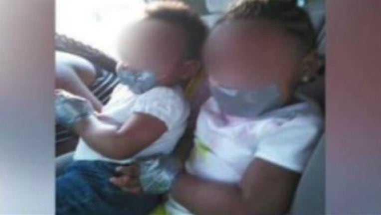 toddlers duct taped_1458590536078-404959.JPG